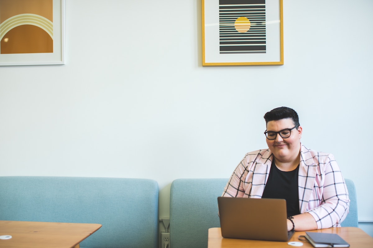 A Customer Service Team Member Works on a Laptop in a Modern Office Salsify How to Respond to Customer Reviews