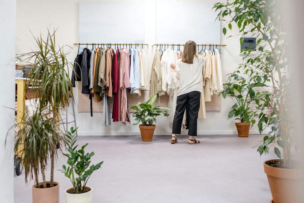 Shop owner taking product inventory to enter in their PIM